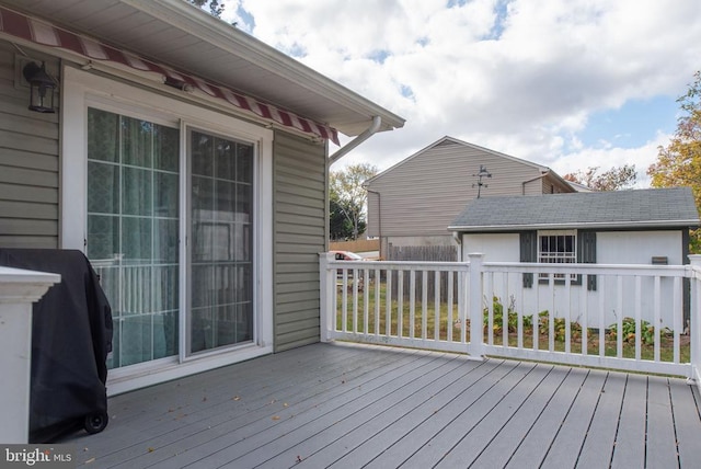 deck featuring an outdoor structure