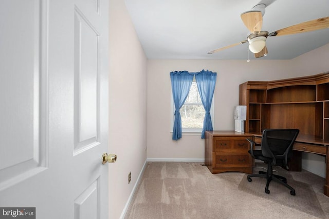 office with light carpet, ceiling fan, and baseboards