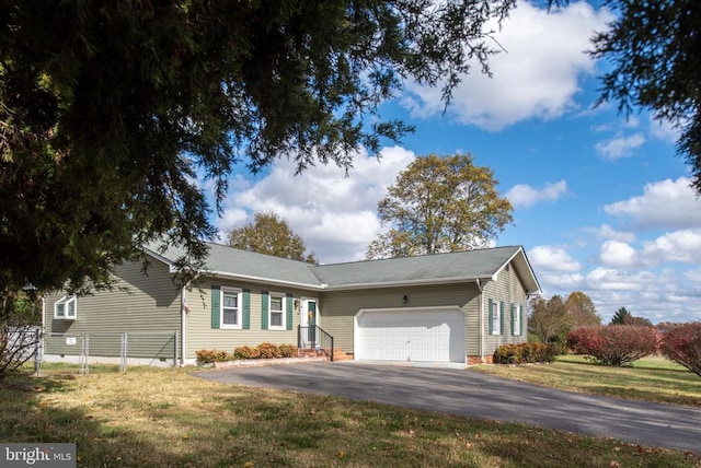 single story home featuring aphalt driveway, fence, a front yard, an attached garage, and crawl space