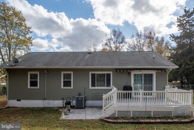 rear view of house featuring central AC, roof with shingles, a deck, crawl space, and a patio