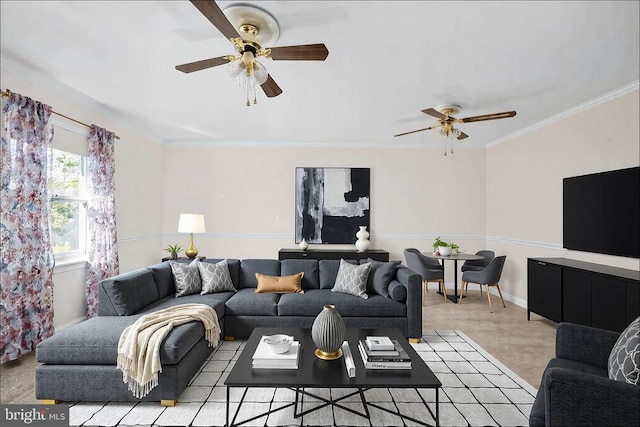 living area with a ceiling fan, baseboards, and ornamental molding