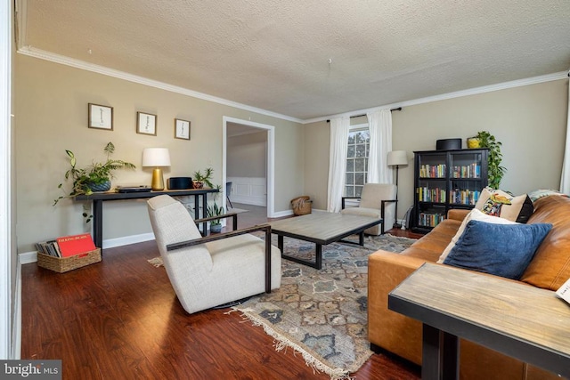 living room featuring wood finished floors, crown molding, a textured ceiling, and baseboards