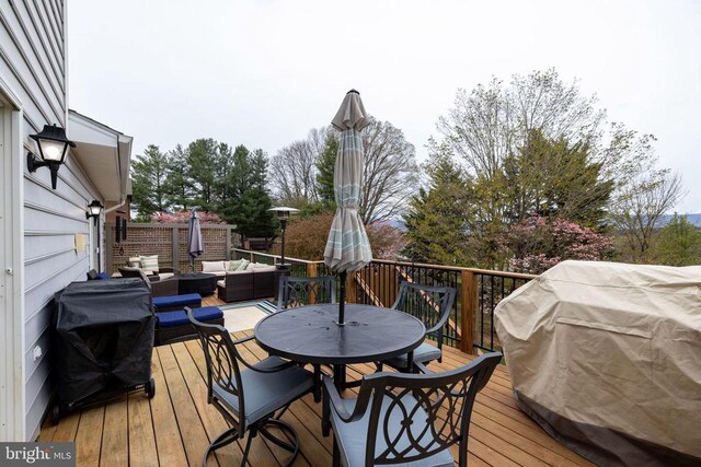 deck featuring an outdoor hangout area and outdoor dining area