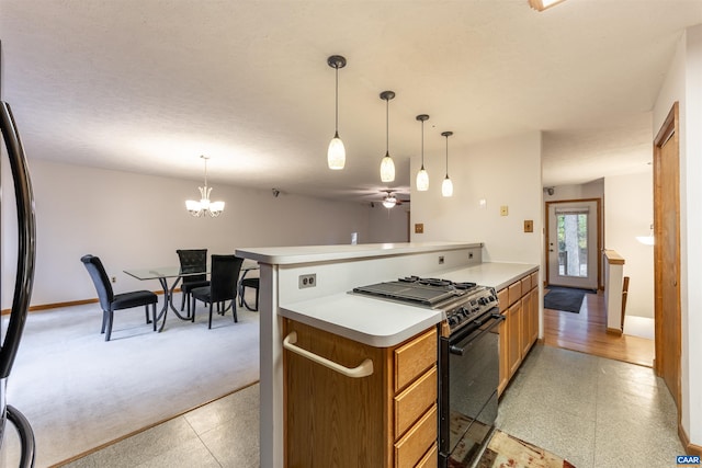 210 Pasture Ln, Stanardsville, VA 22973 - kitchen featuring freestanding refrigerator, black gas range oven, brown cabinetry, baseboards, and light countertops