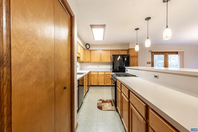 210 Pasture Ln, Stanardsville, VA 22973 - kitchen featuring dishwashing machine, gas range oven, freestanding refrigerator, pendant lighting, and light countertops