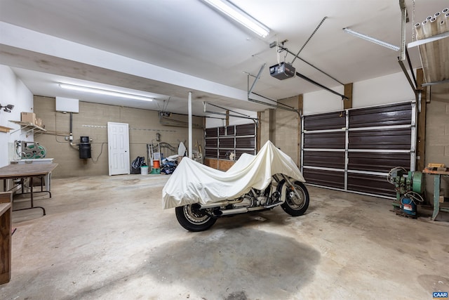 210 Pasture Ln, Stanardsville, VA 22973 - garage with concrete block wall and a garage door opener
