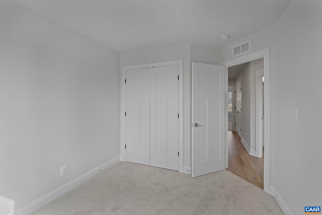 59 Hilah Ln, Charlottesville, VA 22901 - unfurnished bedroom featuring a closet, visible vents, baseboards, and carpet floors