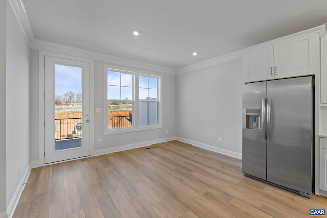 59 Hilah Ln, Charlottesville, VA 22901 - kitchen with light wood-style flooring, baseboards, white cabinetry, crown molding, and stainless steel refrigerator with ice dispenser