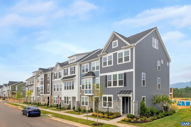 59 Hilah Ln, Charlottesville, VA 22901 - townhome / multi-family property featuring board and batten siding, a residential view, a standing seam roof, and stone siding