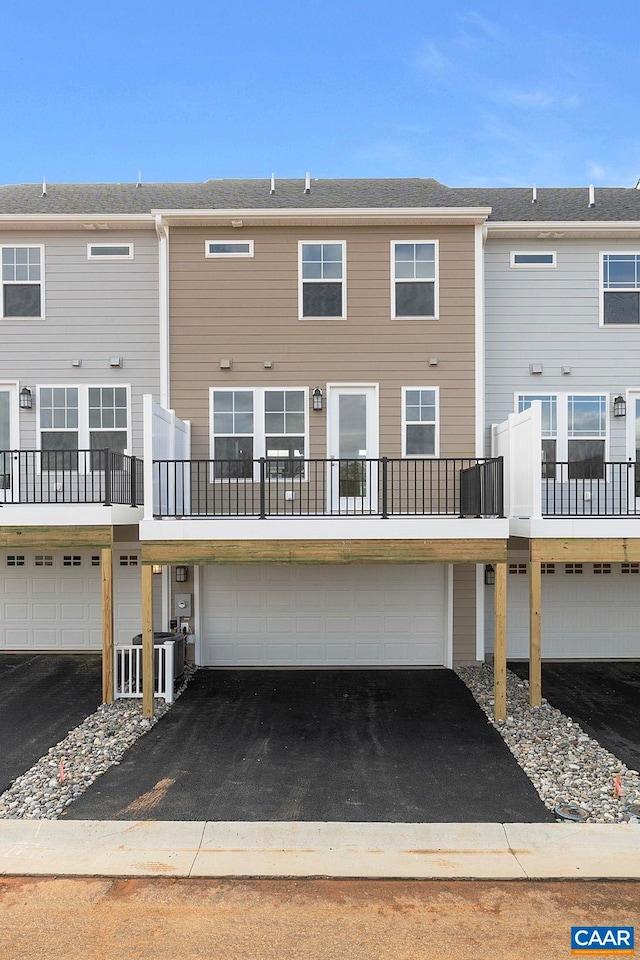 59 Hilah Ln, Charlottesville, VA 22901 - back of house with aphalt driveway and a garage
