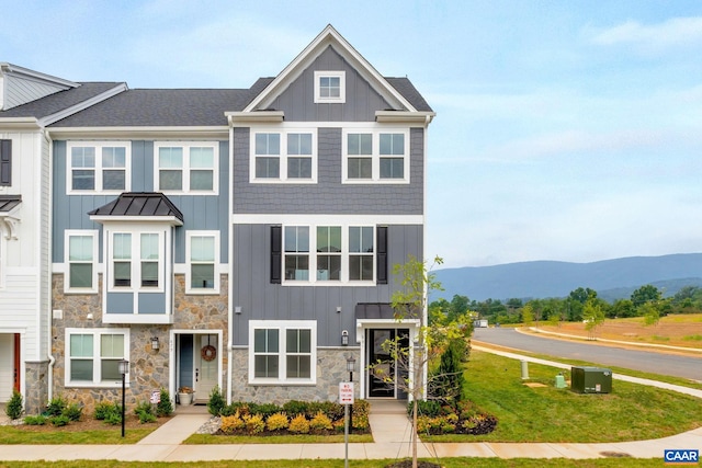 59 Hilah Ln, Charlottesville, VA 22901 - view of front of house with board and batten siding, stone siding, a mountain view, and a standing seam roof