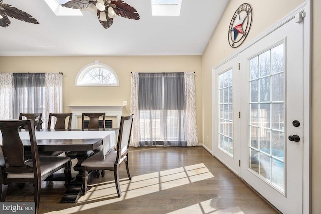 5819 Telluride Ln, Spotsylvania, VA 22553 - dining room with a skylight, wood finished floors, a ceiling fan, and lofted ceiling