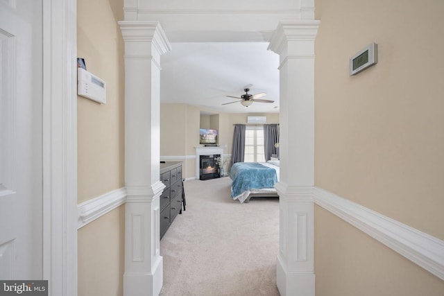 5819 Telluride Ln, Spotsylvania, VA 22553 - bedroom with light carpet, a glass covered fireplace, ornate columns, and ceiling fan