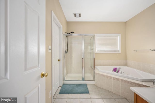 5819 Telluride Ln, Spotsylvania, VA 22553 - bathroom featuring tile patterned floors, a stall shower, a bath, and vanity