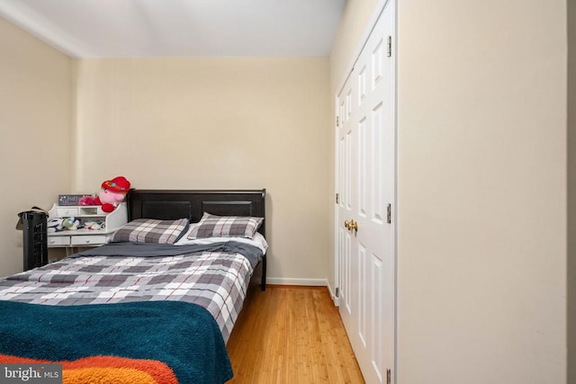 5819 Telluride Ln, Spotsylvania, VA 22553 - bedroom featuring wood finished floors, a closet, and baseboards
