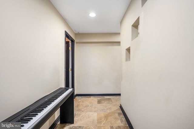 5819 Telluride Ln, Spotsylvania, VA 22553 - corridor featuring stone finish flooring, baseboards, and recessed lighting