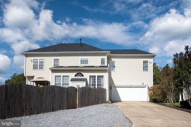 5819 Telluride Ln, Spotsylvania, VA 22553 - back of property with an attached garage, fence, concrete driveway, and a gazebo