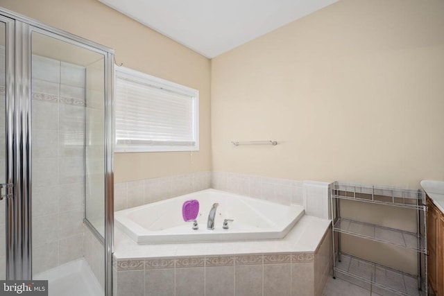 5819 Telluride Ln, Spotsylvania, VA 22553 - bathroom featuring vanity, a bath, and a shower stall