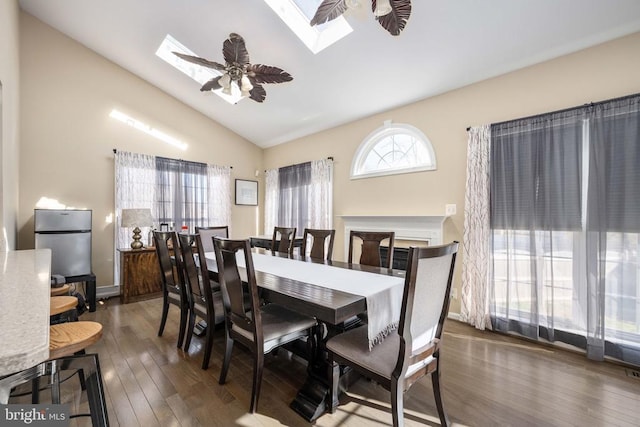 5819 Telluride Ln, Spotsylvania, VA 22553 - dining space with a skylight, vaulted ceiling, wood finished floors, and ceiling fan