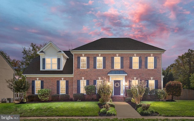 5819 Telluride Ln, Spotsylvania, VA 22553 - colonial-style house with brick siding and central AC