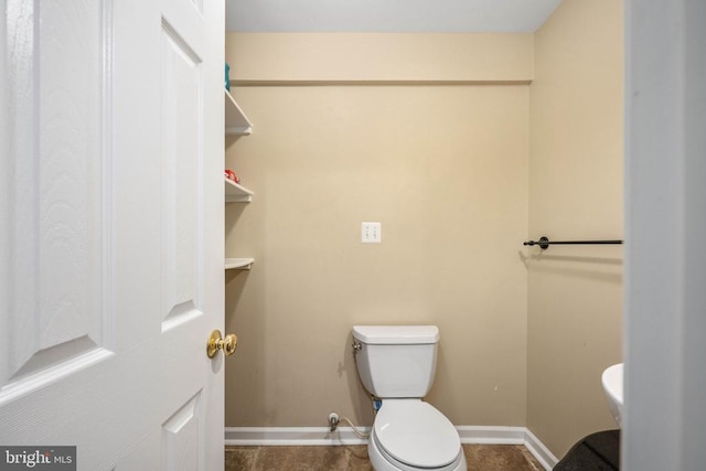 5819 Telluride Ln, Spotsylvania, VA 22553 - half bath featuring toilet and baseboards