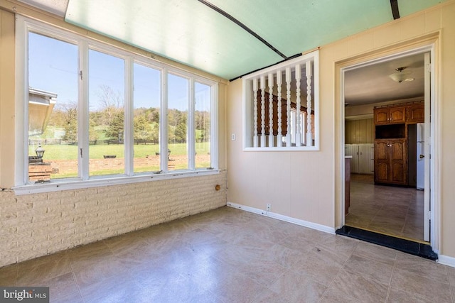 407 Kite Hollow Rd, Stanley, VA 22851 - unfurnished room featuring brick wall and baseboards