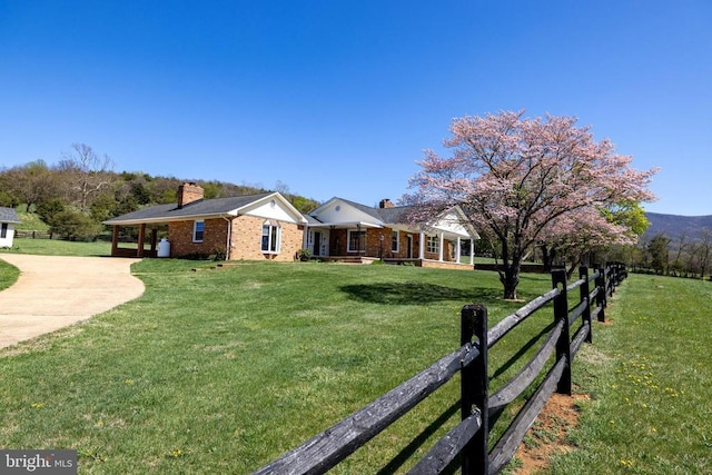 407 Kite Hollow Rd, Stanley, VA 22851 - view of front facade featuring a chimney, driveway, brick siding, and a carport