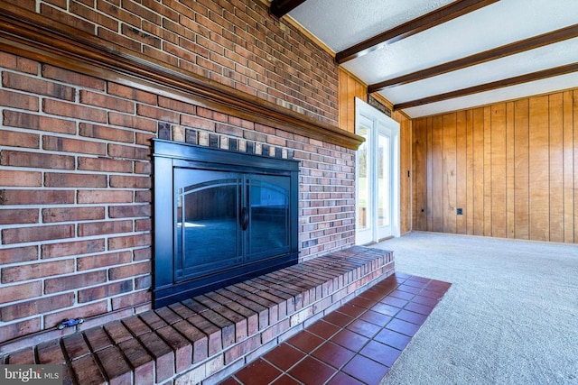 407 Kite Hollow Rd, Stanley, VA 22851 - detailed view of wood walls, beam ceiling, carpet, and a brick fireplace