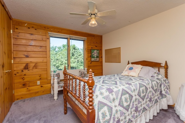1003 Natural Chimneys Rd, Mount Solon, VA 22843 - carpeted bedroom featuring wooden walls, ceiling fan, and a textured ceiling