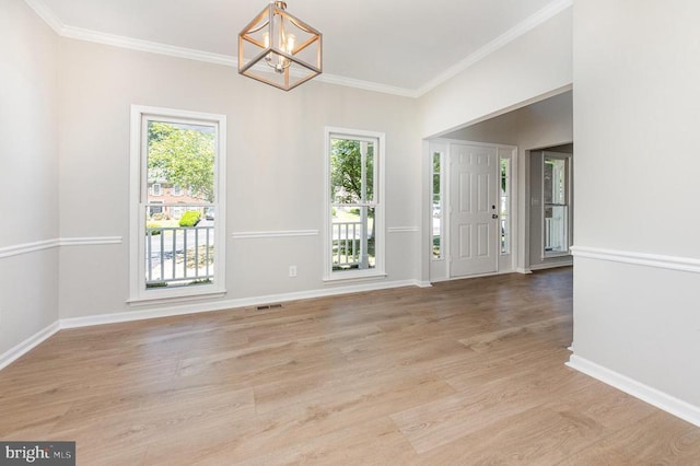 5907 Cambridge Dr, Fredericksburg, VA 22407 - entryway with a chandelier, plenty of natural light, light wood-type flooring, crown molding, and baseboards