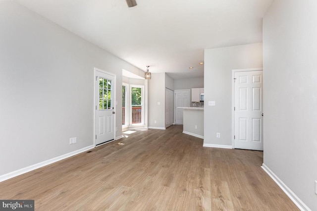 5907 Cambridge Dr, Fredericksburg, VA 22407 - unfurnished living room with light wood finished floors, baseboards, and ceiling fan