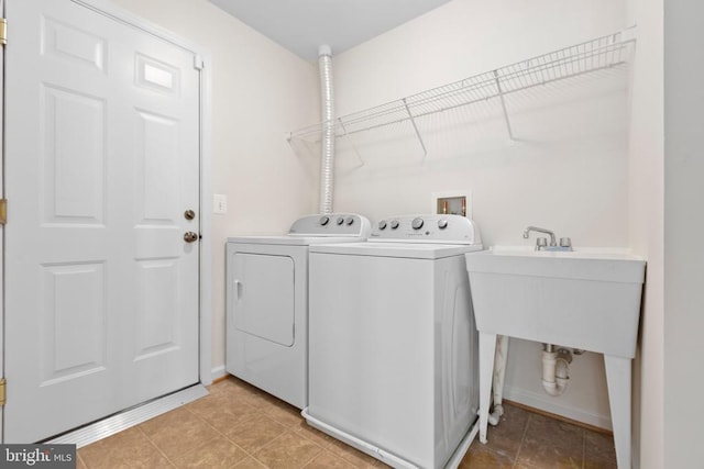 5910 Carnifex Ferry Rd W, Fredericksburg, VA 22407 - laundry room with separate washer and dryer and baseboards