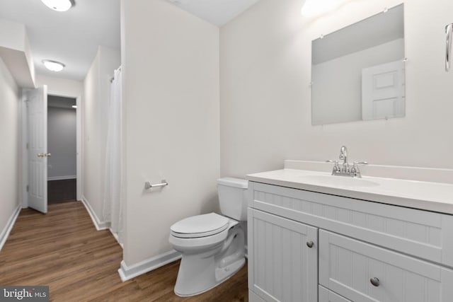 5910 Carnifex Ferry Rd W, Fredericksburg, VA 22407 - full bathroom with vanity, wood finished floors, toilet, and baseboards