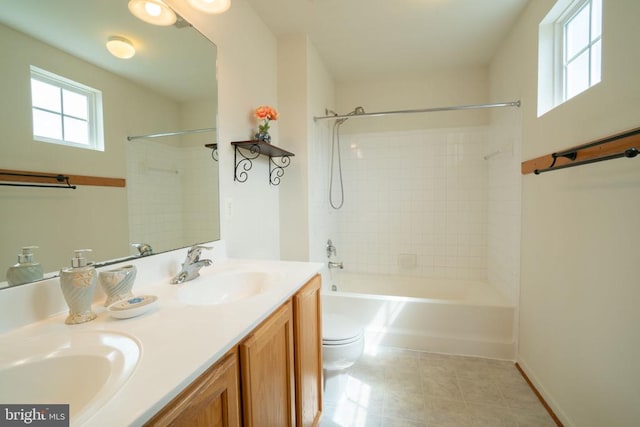 full bathroom with toilet, double vanity, tile patterned floors, and tub / shower combination