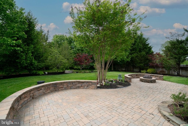 view of patio featuring an outdoor fire pit