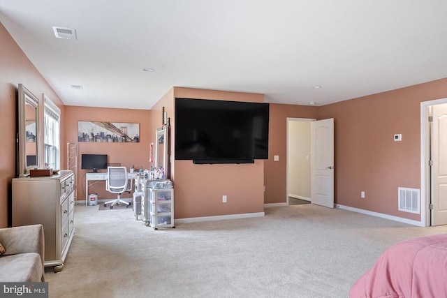 bedroom featuring baseboards, light carpet, and visible vents