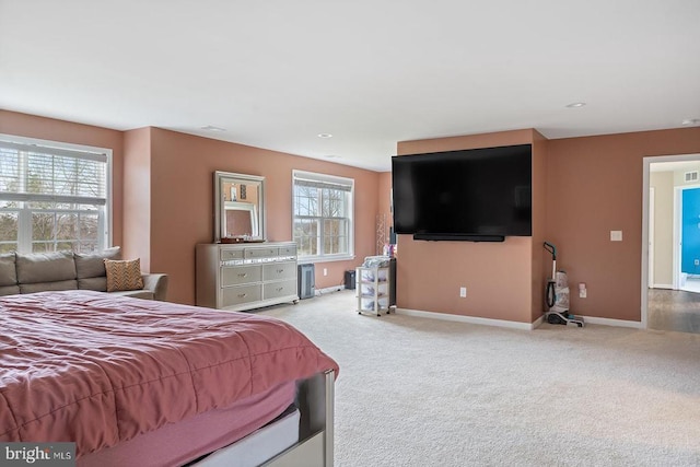 carpeted bedroom featuring baseboards, visible vents, and recessed lighting
