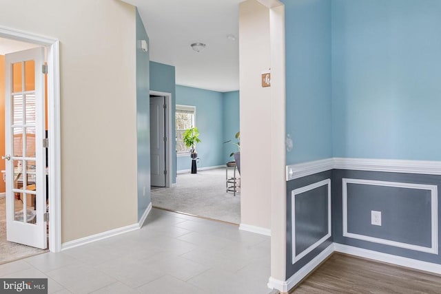 hall featuring baseboards