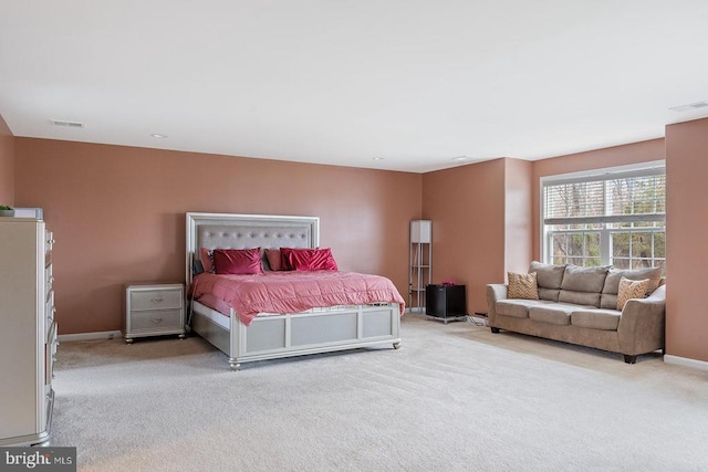 bedroom featuring baseboards, visible vents, and carpet floors