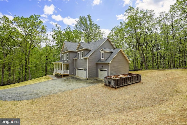  - view of front facade with a garage and driveway