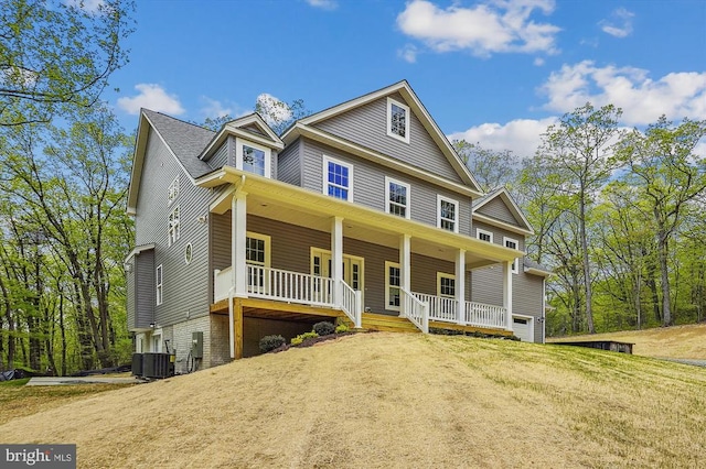  - view of front of property featuring a porch and cooling unit