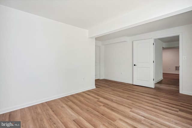  - unfurnished bedroom with light wood-type flooring and baseboards