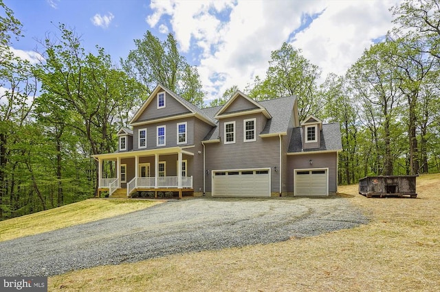  - view of front of house featuring covered porch, a garage, driveway, and a shingled roof