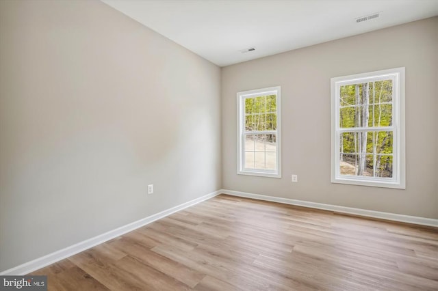  - empty room featuring light wood-style flooring and baseboards