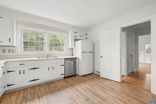 7928 Howardsville Rd, Scottsville, VA 24562 - kitchen with stainless steel dishwasher, freestanding refrigerator, light wood-style flooring, and plenty of natural light