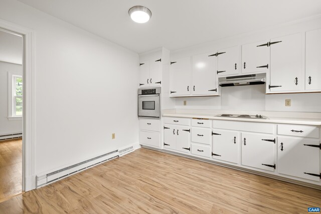 7928 Howardsville Rd, Scottsville, VA 24562 - kitchen featuring oven, baseboard heating, white stovetop, and white cabinetry