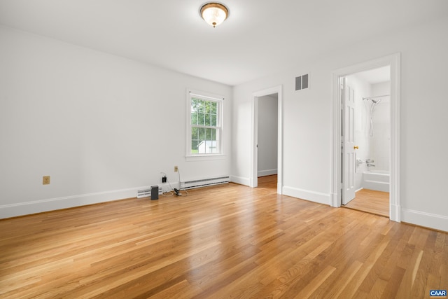 7928 Howardsville Rd, Scottsville, VA 24562 - unfurnished bedroom with light wood-style flooring, a baseboard heating unit, and ensuite bathroom