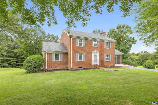7928 Howardsville Rd, Scottsville, VA 24562 - colonial house with brick siding, a chimney, a front yard, and driveway