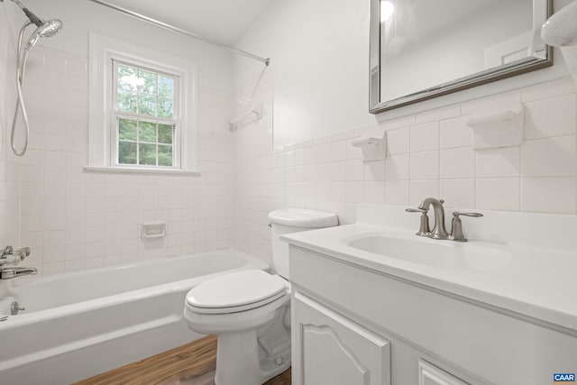 7928 Howardsville Rd, Scottsville, VA 24562 - full bathroom with tile walls,  shower combination, vanity, and tasteful backsplash
