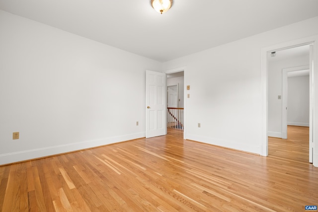 7928 Howardsville Rd, Scottsville, VA 24562 - unfurnished room with light wood finished floors and baseboards